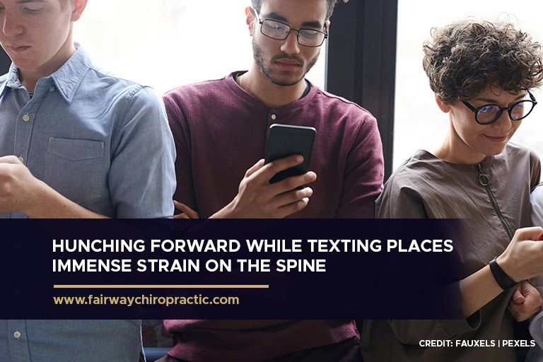 Hunching forward while texting places immense strain on the spine