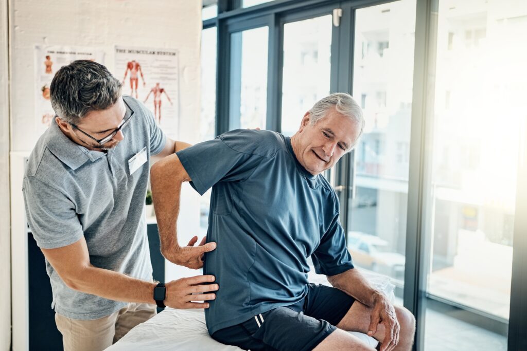 Physio,Therapist,,Chiropractor,And,Senior,Man,With,Back,Pain,For