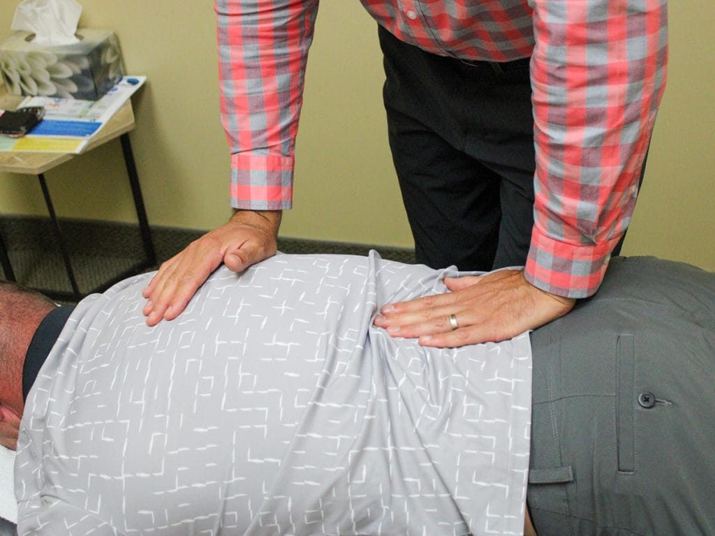 Hands-on chiropractic adjustment in clinic