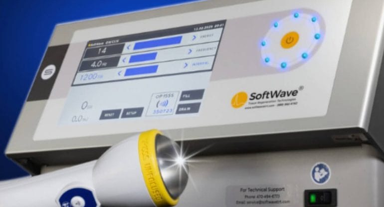 SoftWave Tissue Regenerative Therapy device with focused acoustic wave applicator, used in non-surgical treatment to support tissue healing and pain reduction.