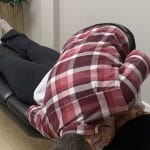 Dr. Nik Dukovac performing a chiropractic spinal adjustment at Fairway Chiropractic Centre in Kitchener