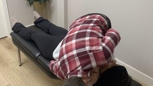 Dr. Nik Dukovac performing a chiropractic spinal adjustment at Fairway Chiropractic Centre in Kitchener