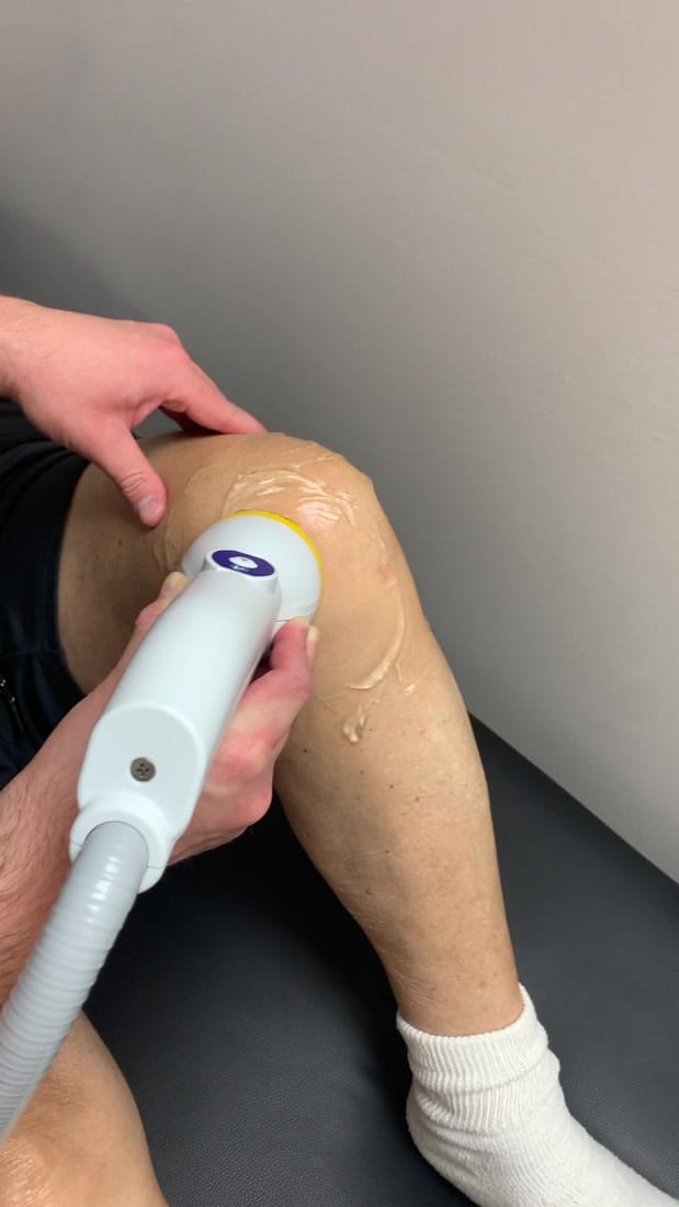 SoftWave Tissue Regenerative Therapy applicator treating knee arthritis and surrounding soft tissue