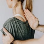 Chiropractor assessing a patient spine for spinal decompression in Kitchener