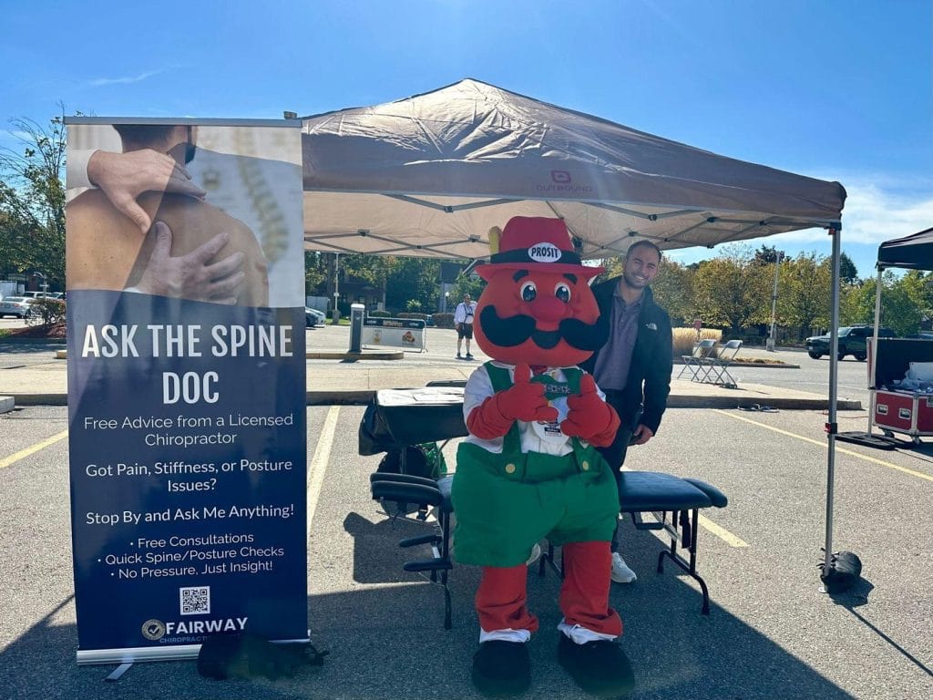 Dr. Adrian Bugiel at the Ask the Spine Doc booth at an outdoor community event